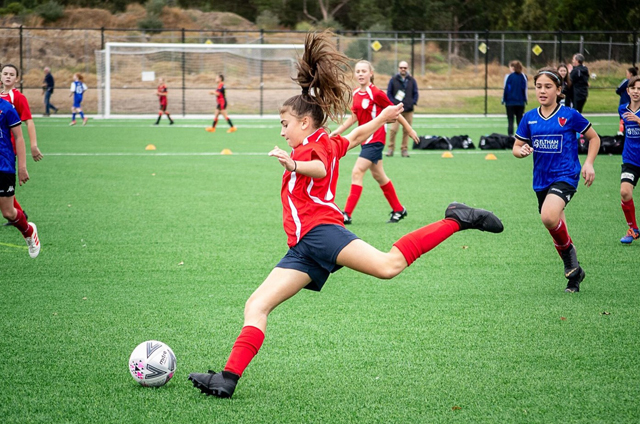 DAREBIN FALCONS JUNIOR SOCCER - GIRL KICKING FOOTBALL SOCCER